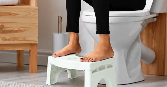 Medlinkx footstool in use in front of a toilet